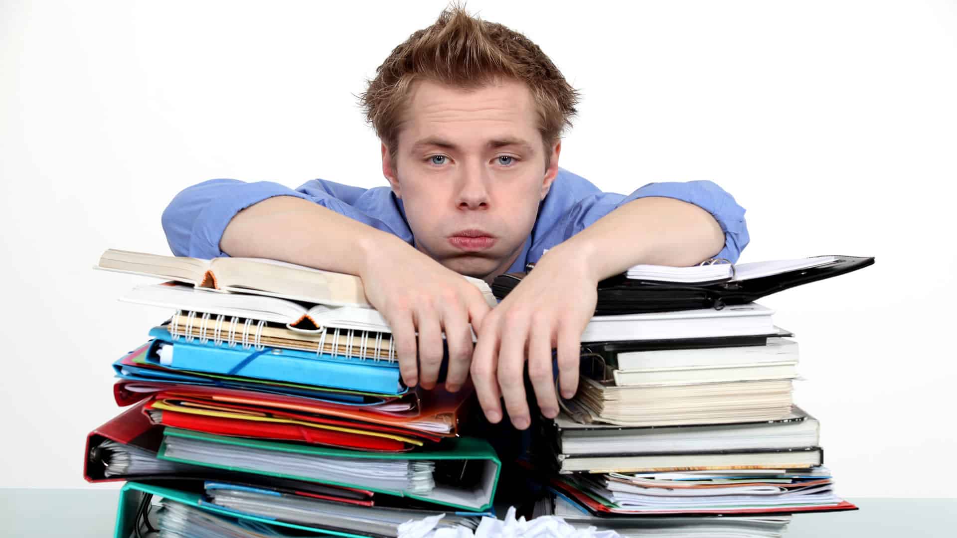 Image of a student stressed out by a heavy study workload.